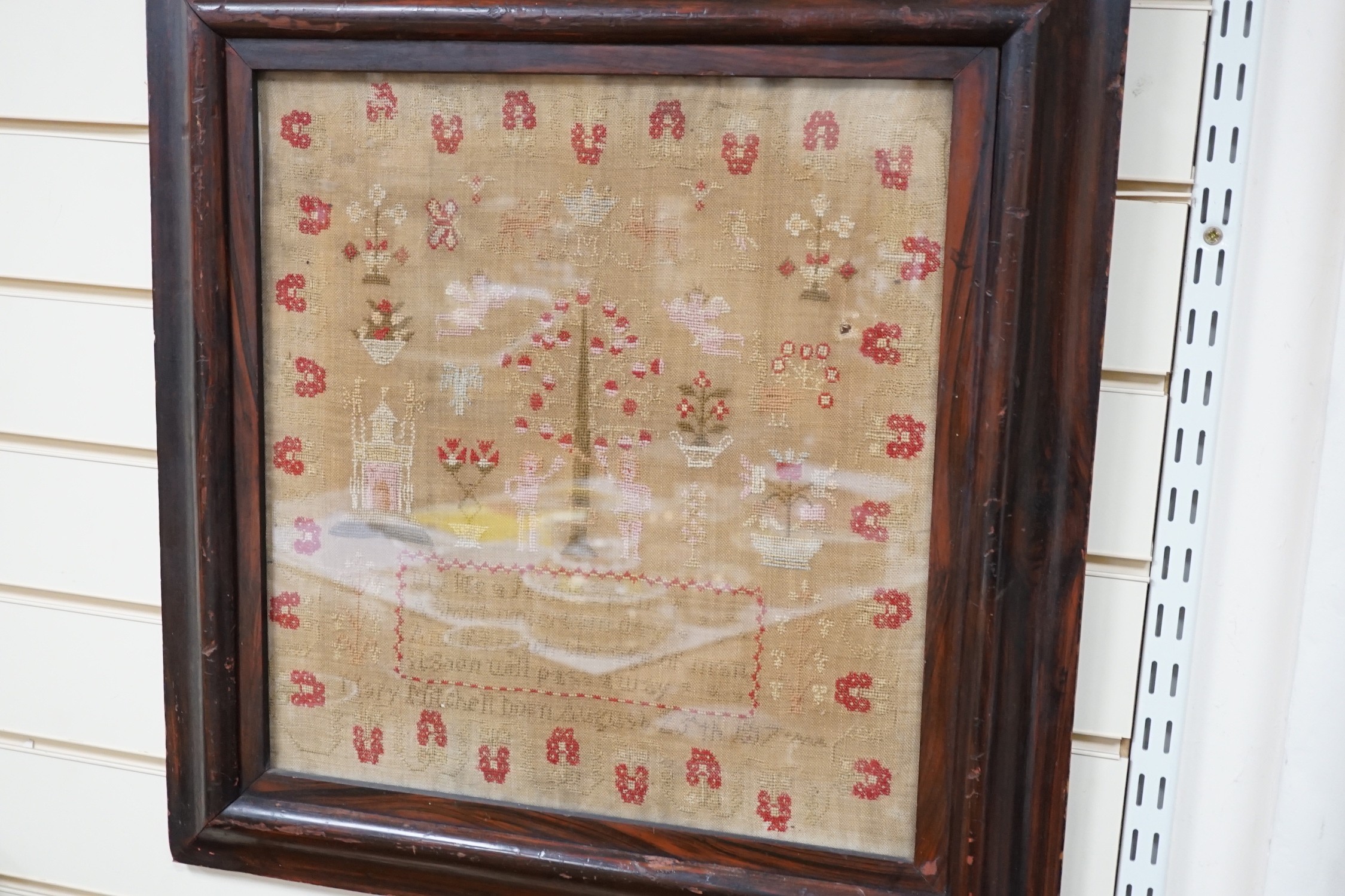 A large framed sampler, 1817, 57 x 56cm including frame